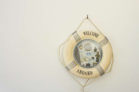 decor lifebuoy, white lifebuoy decorated with sea shells の写真素材