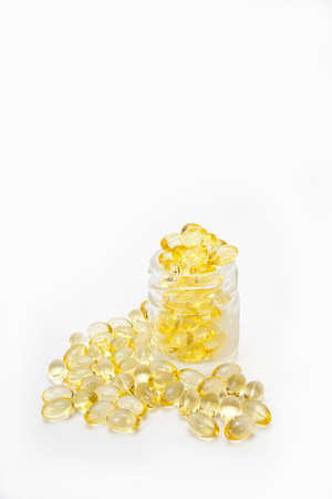 vitamin, yellow clear vitamin tablets in clear bottleの写真素材