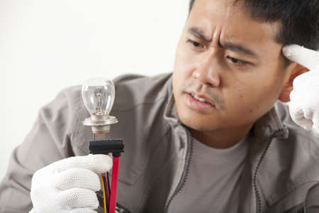 worry electrician, male engineer got thinking seriously about one bulb