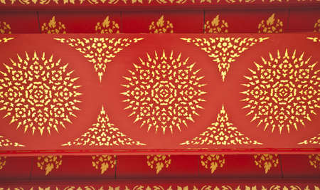 Thai paint, Golden drawing Thai style paint pattern with red backgroundの写真素材