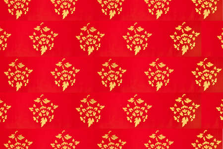 Thai paint, Golden drawing Thai style paint pattern with red backgroundの写真素材