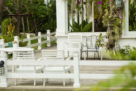 resting area, white bench on balcony rest garden areaの写真素材