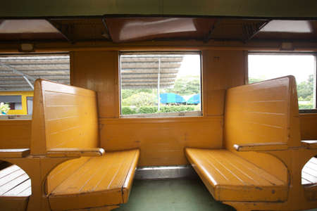 empty seats, wooden empty seats row on train bogeyのeditorial素材