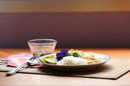 Thai food, Southern style of Thai mixed vegetable and rice with crushed dried shrimp and coconut with sauce called Khao-Yumの写真素材