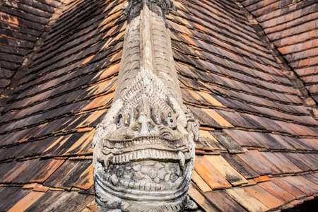 Thai temple, cement dragon decorated on temple roofの写真素材