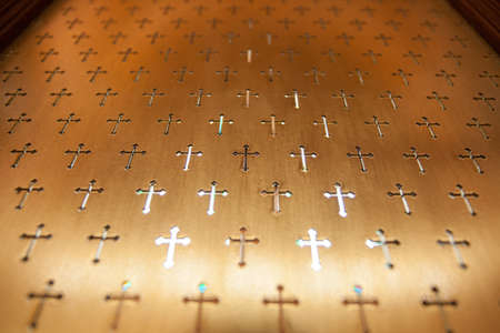 cross wallpaper, copper metal church partition with pattern of cross carvingの写真素材
