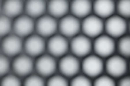 hexagon plastic, close-up to texture surface of hexagon plastic net screen sheet, blurの写真素材