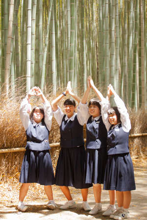 Japanese student, Kids Japanese student smiling pose in Arayshiyama, Japanのeditorial素材