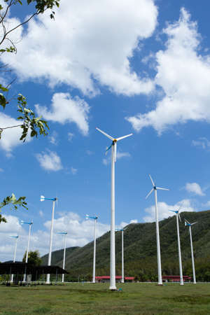wind turbines, field of wind turbines in empty wide land with mountainの写真素材
