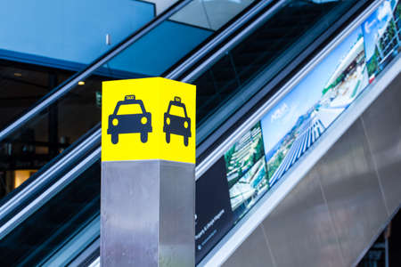 taxi stand, yellow taxi symbol pole signboard with lightの写真素材