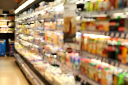 supermarket, blur view of beverage product on refrigerator shelves in supermarketの写真素材