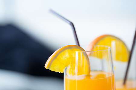 orange juice, fresh orange juice in decorated glasses and straws