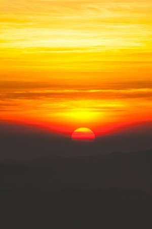 sunset, Red sky of sunset over high mountain showing twilight cloudscapeの写真素材