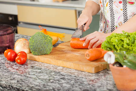 Woman Chef, An Asian woman chef pose showing cooking in the kitchen