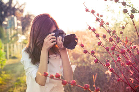 camera girl Thai Asian camera girl shot in natural smiling cute action in the garden and evening...