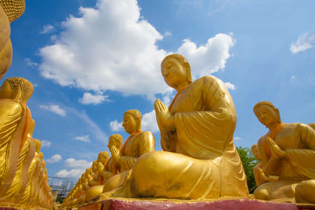 Buddha differences image act of golden Buddha with the main Buddha statue outdoor Thailandの写真素材