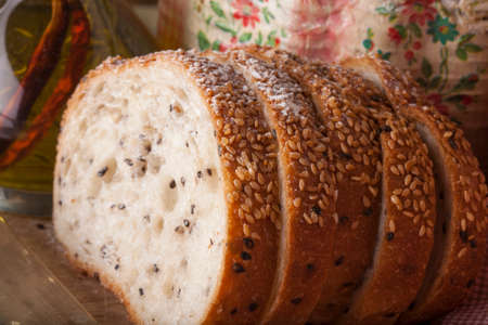 Bread, a set of variation of breads on a wood chopping block with spike