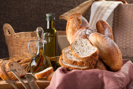 Bread, a set of variation of breads on a wood chopping block with spikeの写真素材