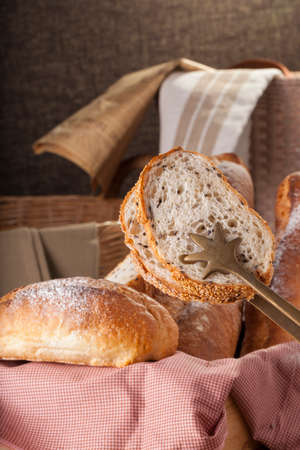 Bread, a set of variation of breads on a wood chopping block with spike