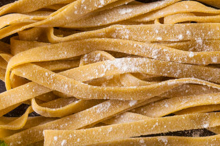 Fresh Pasta, close-up texture of Home made tagliatelle pasta flour ribbon noodleの写真素材