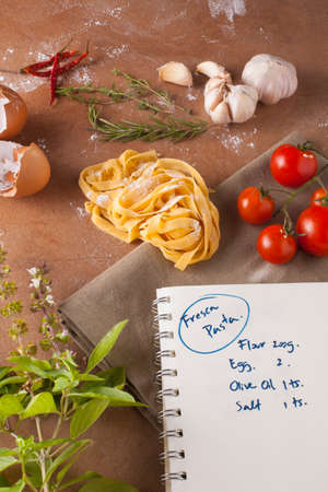 Pasta menu, Preparation of pasta recipe ingredients with empty notebook written how to make fresh pastaの写真素材