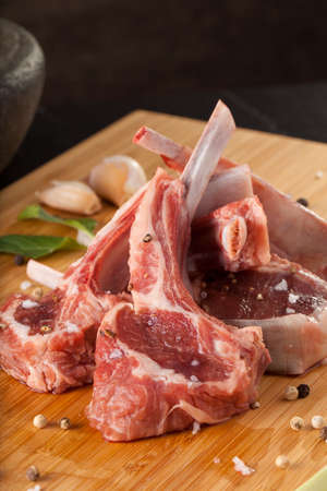 Thai Rack of lamb, Raw rack of lamb cut in pieces decorate and seasoning with Thai herbの写真素材