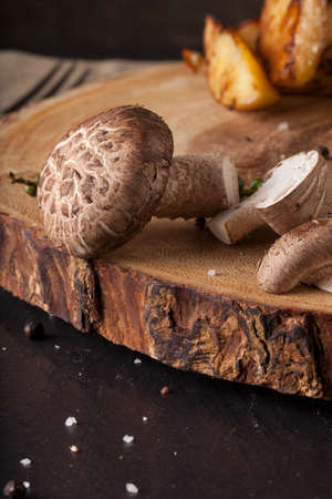 steak sides, champignon mushroom and asparagus served with steak in a meal wooden block plateの写真素材