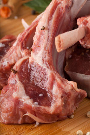 Thai Rack of lamb, Raw rack of lamb cut in pieces decorate and seasoning with Thai herbの写真素材