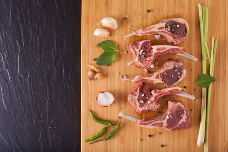 Thai Rack of lamb, Raw rack of lamb cut in pieces decorate and seasoning with Thai herbの写真素材