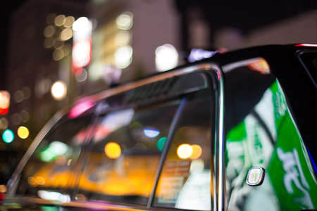 Osaka, Japan - 7 NOV 2015 Night shift Black taxi line up in queue in the city centre Osaka, Japanのeditorial素材