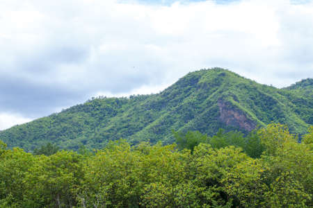 green mountain and cloud, scenic of cloudy sky with mountain hill and green forest in Thailandの写真素材