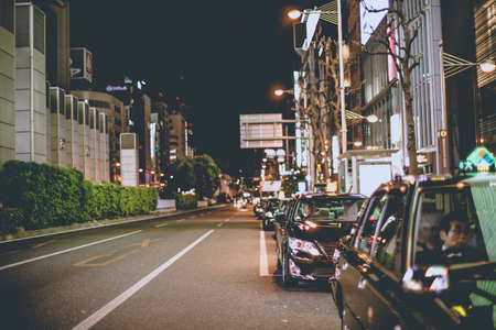 OSAKA, JAPAN - NOVEMBER 10,2015 the black taxi are waiting in line on road side of  Osaka city near...