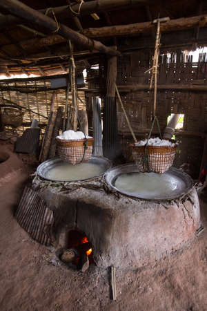 An ancient offshore salt well equipment hanging in the home made factory Bor-Klauer District, Nan, Thailandの写真素材