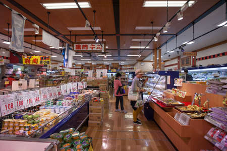 Many kind of product selling on shelf in supermarket at Kuromon market, Osaka, japan 5 Nov 2015のeditorial素材