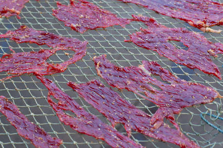 Close up texture of seasoning sun dried beef using local procedure of food preservation in Thailand.の写真素材