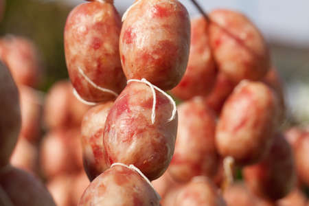 Close up texture of seasoning sun dried Thai home made style sausage using local procedure of food preservation in Thailand.の写真素材
