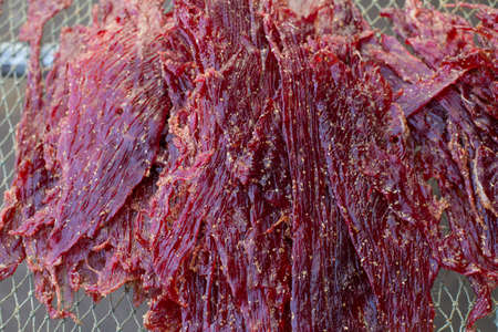 Close up texture of seasoning sun dried beef using local procedure of food preservation in Thailand.の写真素材