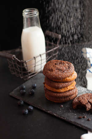 Chocolate ship soft cookies pile up decorate with chocolate ship and milk in a bottle.の写真素材