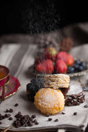 Mix flavour of scone biscuit decorate with chocolate ship and fresh strawberry and blueberry