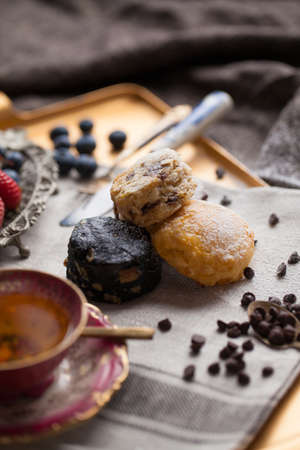 Mix flavour of scone biscuit decorate with chocolate ship and fresh strawberry and blueberryの写真素材