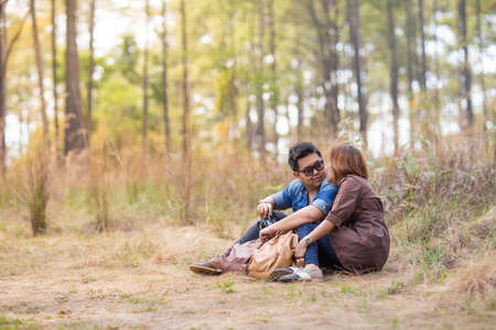 An Asian young adult couple traveling in pine forest, Thailandの写真素材