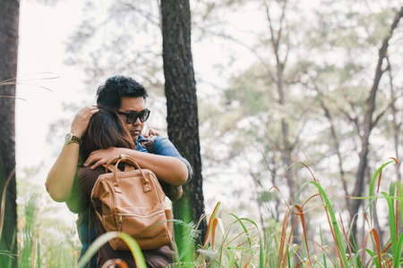 An Asian young adult couple traveling in pine forest, Thailandの写真素材