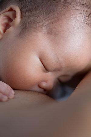 Asian baby boy breastfeeding top view