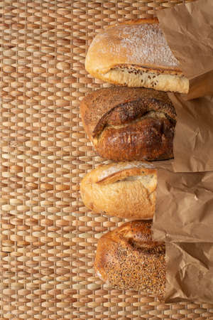 Various kind of bread put together on weave grass background with copy space.の写真素材