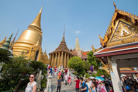 Bangkok, Thailand - February 10, 2018 :  Unidentified tourists travel to Wat Phra Kaew and Grand Palace, with blue sky.のeditorial素材