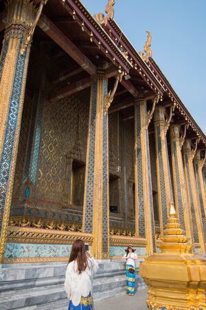 Bangkok, Thailand - February 10, 2018 :  Unidentified people are traveling and taking photos in the temple of Wat Phra Kaew at Grand Palace, Bangkok, Thailand.のeditorial素材