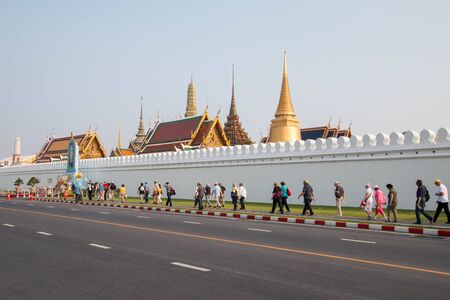 Bangkok, Thailand - February 10, 2018 : Many tourist are walking pass Temple of Emerald Buddha's wall as know as "Wat Phra Kaew" or âGrand Palaceâ Buddhist temple in Thailandのeditorial素材