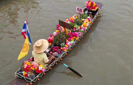AYUTTHAYA, THAILAND - July 27, 2018 : Buddhists do candle festival parade by boat at Ladchado canal in Phra Nakhon Si Ayutthaya Province, Thailand.のeditorial素材