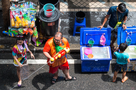 BANGKOK, THAILAND - April 15, 2019 : Tourists shooting water guns and having fun at Songkran festival, Silom Road in Bangkok.のeditorial素材