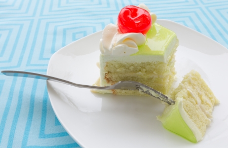 vanilla cake slice with fresh cherryの写真素材